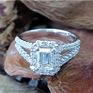 Emerald cut halo engagement ring