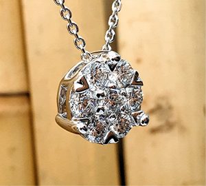 Seven diamond round cluster pendant