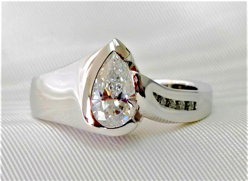 Pear shaped diamond engagement ring