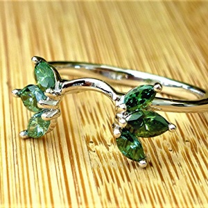 Six green marquise diamond wrap ring