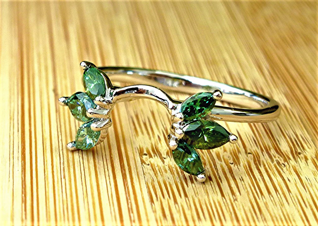 Six green marquise diamond wrap ring