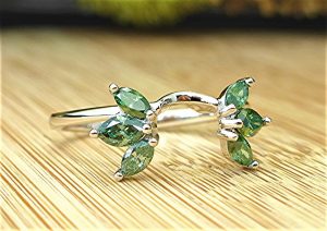 Six green marquise diamond wrap ring