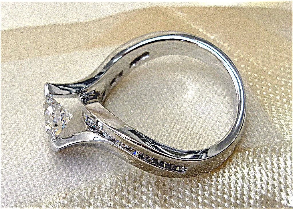 Tension set twisted engagement ring