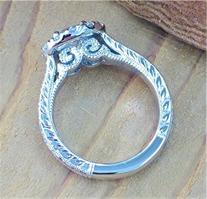Diamond halo engagement ring with scroll work