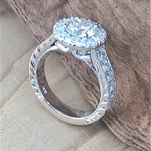 Diamond halo engagement ring with scroll work