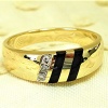 Diamond and onyx gold ring